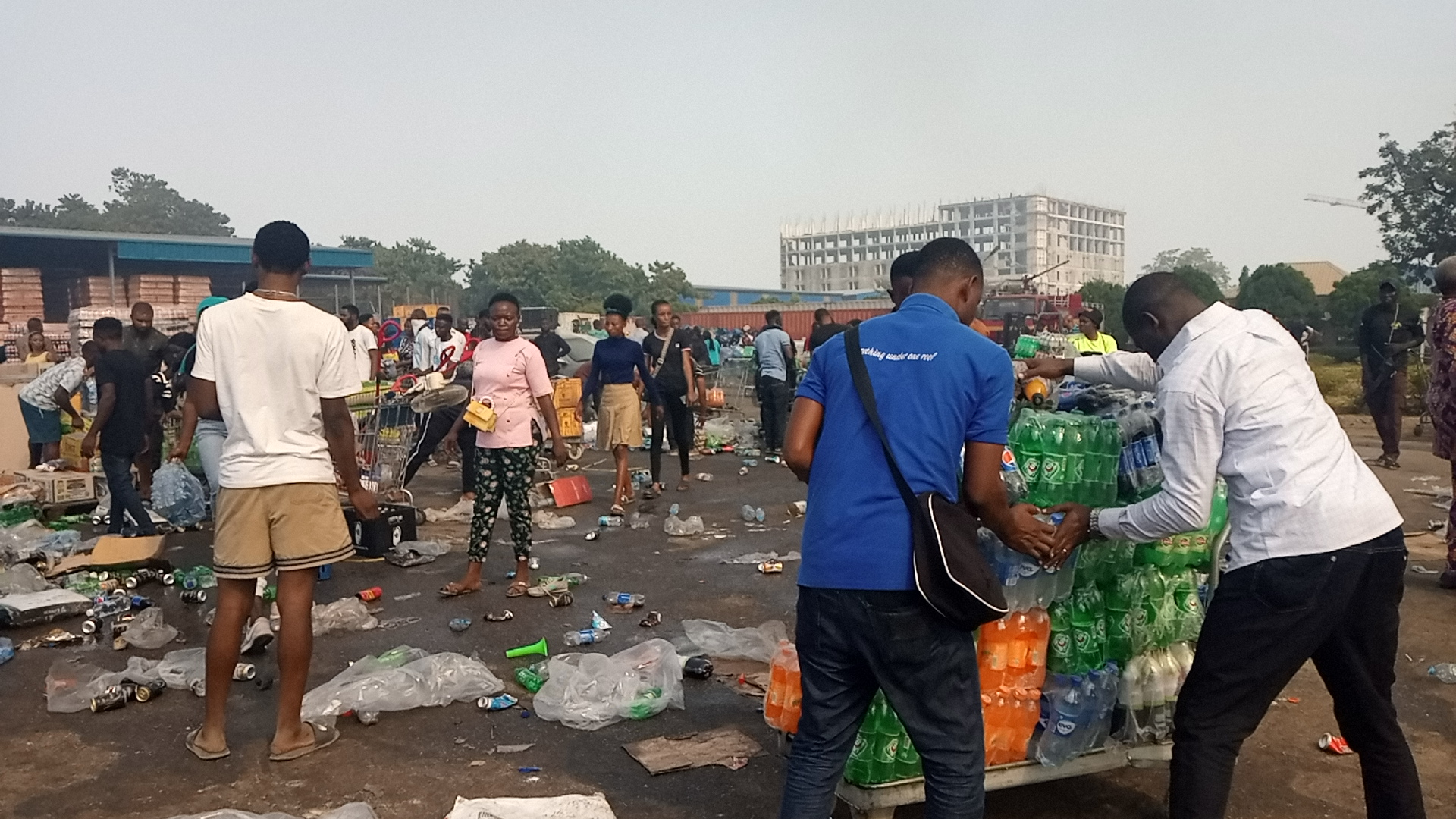 Staff members of Next Cash and Carry sorting salvaged items