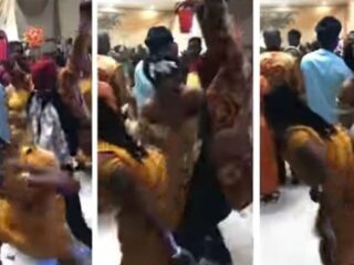 Bride chases off bridesmaid twerking on her husband at their wedding reception