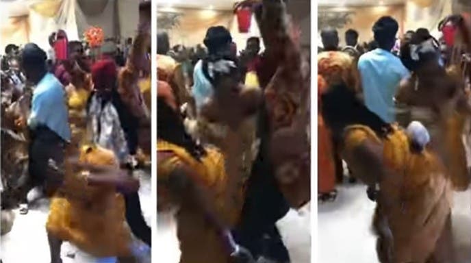 Bride chases off bridesmaid twerking on her husband at their wedding reception