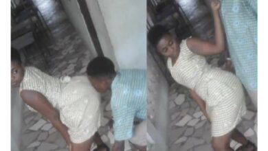 School girl stirs reaction as she twerks seductively against male classmate in school building (Watch Video)