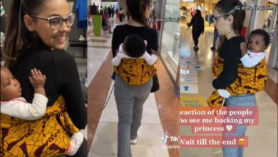 "This wrapper still first me enter overseas" - Oyinbo lady backs her baby abroad with wrapper, Video Goes Viral