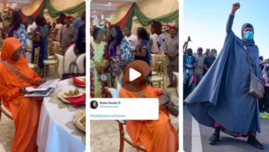 “To serve Nigeria is not by force 😂” – Reactions As Activist Aisha Yesufu Refuses To Stand Up For The Newly Adopted National Anthem When Recited At An Event (VIDEO)